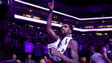 Dec 3, 2024; Sacramento, California, USA; Sacramento Kings guard Malik Monk (0) points his finger up in celebration after the game against the Houston Rockets at Golden 1 Center. Mandatory Credit: Sergio Estrada-Imagn Images
