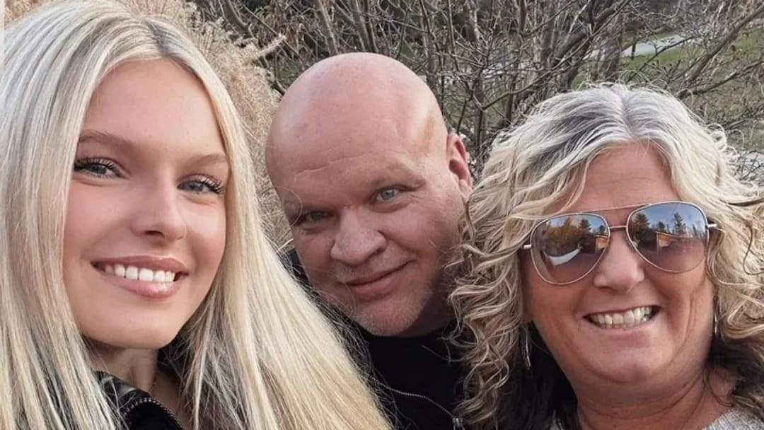 Miller family poses for a picture with Marlee (left), Bill (center), and Gendie (right).