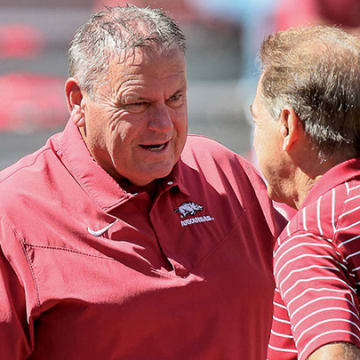 Arkansas coach Sam Pittman talks with Nick Saban before the Razorbacks' game against Alabama.