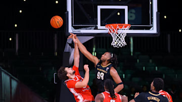 Devin McGlockton (99) blocks a shot.