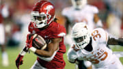 Arkansas running back AJ Green runs for a touchdown in a blowout of Texas at Razorbacks Stadium in 2021.