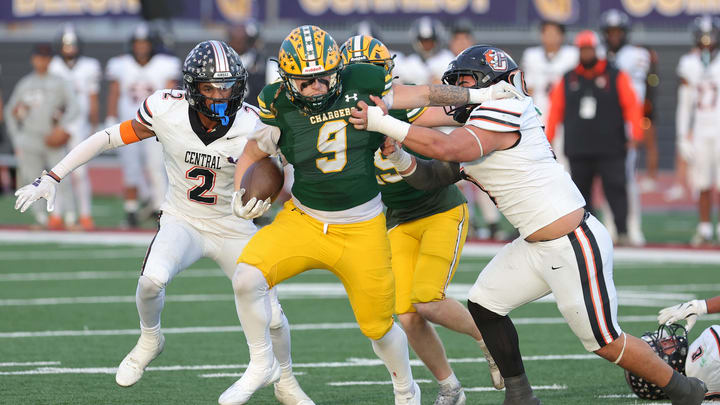 Edison senior Julius Gillick (9) breaks tackle on way to a 14-yard second-quarter touchdown run in terrific first half against Fresno Central in CIF Division 1-A championship game at Saddleback College.