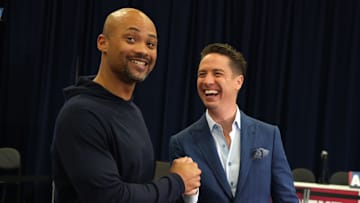 Feb 27, 2024; Indianapolis, IN, USA; NFL Network media insider reporter Tom Pelissero (right) shakes hands with Atlanta Falcons general manager Terry Fontenot during the NFL Scouting Combine at Indiana Convention Center. Mandatory Credit: Kirby Lee-Imagn Images