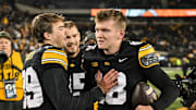 Nov 22, 2025; Iowa City, Iowa, USA; Iowa Hawkeyes kicker Drew Stevens (18) reacts with punter Ty Nissen (99) after the game against the Michigan State Spartans at Kinnick Stadium. Mandatory Credit: Jeffrey Becker-Imagn Images