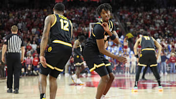 Missouri Tigers guards, Anthony Robinson II (0) and Tony Perkins (12), celebrate a bucket, in a game versus the Arkansas Razorbacks this season.