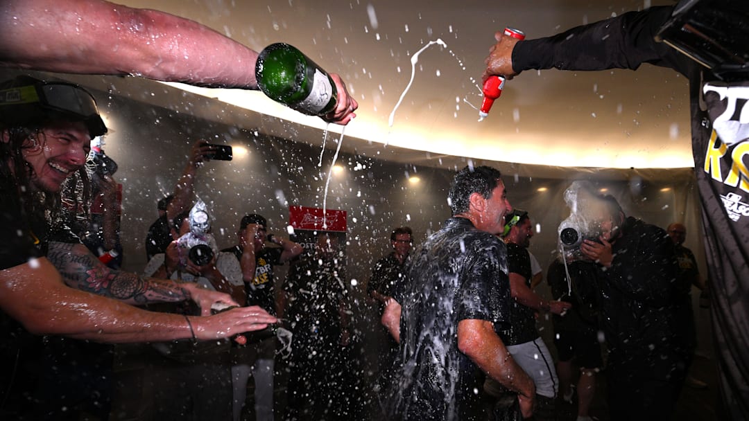 San Diego Padres president and general manager AJ Preller celebrates in the clubhouse following the game against the Chicago White Sox after clinching a playoff berth at Petco Park on Oct. 2, 2022.