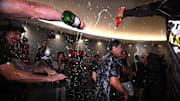 Padres president and general manager AJ Preller celebrates in the clubhouse following the game against the Chicago White Sox after clinching a playoff berth at Petco Park on Oct. 2, 2022.