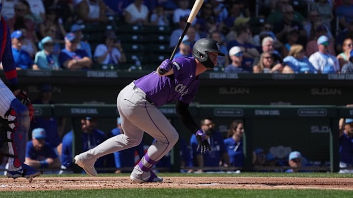 Feb 25, 2026; Mesa, Arizona, USA; Colorado Rockies outfielder Troy Johnston (20) hits against the Chicago Cubs in the first inning at Sloan Park. Mandatory Credit: Rick Scuteri-Imagn Images