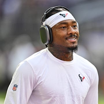 Sep 22, 2024; Minneapolis, Minnesota, USA; Houston Texans wide receiver Stefon Diggs (1) warms up before the game against the Minnesota Vikings at U.S. Bank Stadium. Mandatory Credit: Jeffrey Becker-Imagn Images