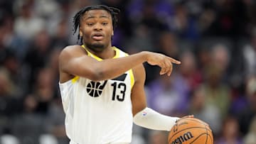Dec 8, 2024; Sacramento, California, USA; Utah Jazz guard Isaiah Collier (13) dribbles against the Sacramento Kings during the third quarter at Golden 1 Center. Mandatory Credit: Darren Yamashita-Imagn Images