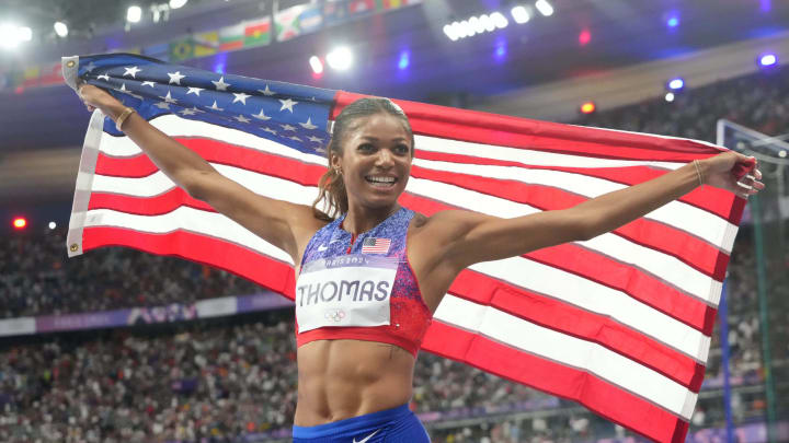 Aug 6, 2024; Saint-Denis, FRANCE; Gabrielle Thomas (USA) celebrates after winning the women's 200m final during the Paris 2024 Olympic Summer Games at Stade de France. Mandatory Credit: Kirby Lee-USA TODAY Sports