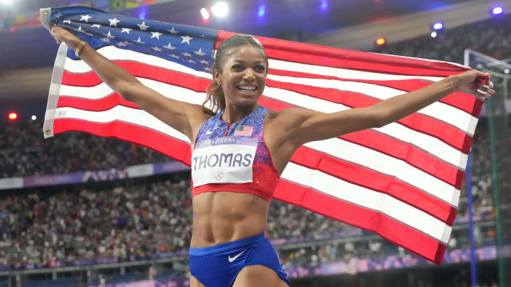 Aug 6, 2024; Saint-Denis, FRANCE; Gabrielle Thomas (USA) celebrates after winning the women's 200m final during the Paris 2024 Olympic Summer Games at Stade de France. 