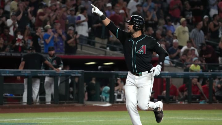 Aug 14, 2024; Phoenix, Arizona, USA; Arizona Diamondbacks third base Eugenio Suarez (28) reacts after hitting a grand slam against the Colorado Rockies in the sixth inning at Chase Field. Mandatory Credit: Rick Scuteri-USA TODAY Sports