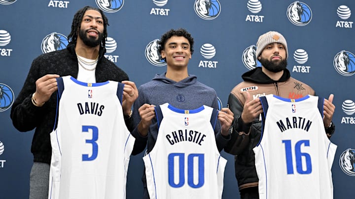 Feb 7, 2025; Dallas, TX, USA; Dallas Mavericks forward Anthony Davis (3) and guard Max Christie (00) and forward Caleb Martin (16) pose for a photo with their new Mavs jerseys during a press conference at the Dallas Mavericks practice facility. Mandatory Credit: Jerome Miron-Imagn Images