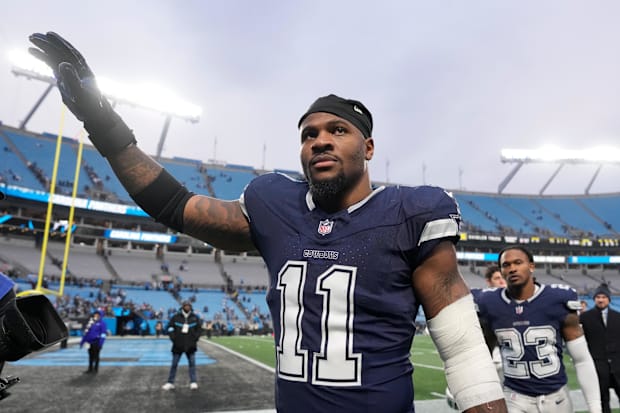 Dallas Cowboys linebacker Micah Parsons walks off the field after the game at Bank of America Stadium. 