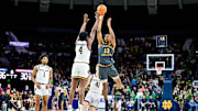 Jan 13, 2025; South Bend, Indiana, USA; Boston College Eagles guard Donald Hand Jr. (13) shoots a three point basket as Notre Dame Fighting Irish guard Sir Mohammed (4) defends in the first half at the Purcell Pavilion. Mandatory Credit: Matt Cashore-Imagn Images
