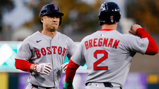 Boston Red Sox designated hitter Rob Refsnyder (30) celebrates with third baseman Alex Bregman