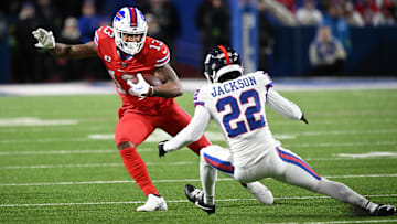 Oct 15, 2023; Orchard Park, New York, USA; Buffalo Bills wide receiver Gabe Davis (13) tries to avoid a tackle by New York Giants cornerback Adoree' Jackson (22) in the first quarter at Highmark Stadium. Mandatory Credit: Mark Konezny-Imagn Images