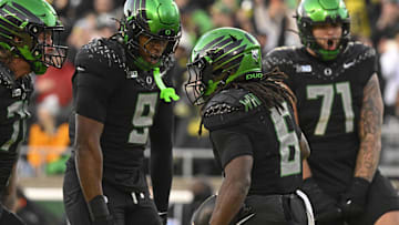 Nov 22, 2025; Eugene, Oregon, USA; Oregon Ducks running back Noah Whittington (6) celebrates with teammate after scoring a touchdown during the second half at Autzen Stadium. Mandatory Credit: Troy Wayrynen-Imagn Images