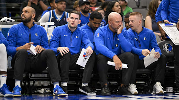 Dallas Mavericks deputy coach, Jared Dudley, and deputy coach Greg St. Jean and head coach Jason Kidd