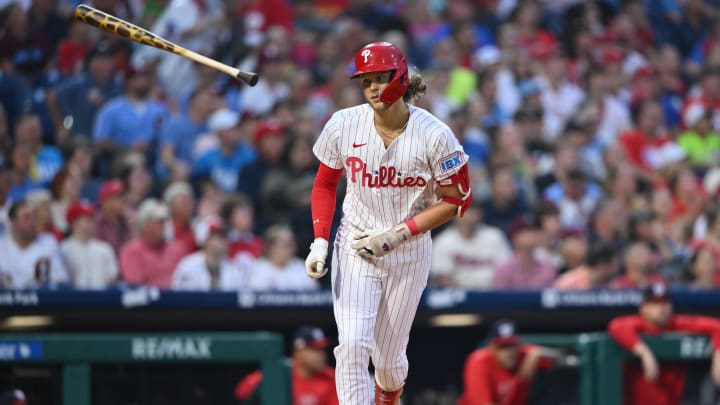 Aug 17, 2024; Philadelphia, Pennsylvania, USA; Philadelphia Phillies infielder Alec Bohm (28) tosses his bat after hitting a fly ball against the Washington Nationals in the second inning at Citizens Bank Park. 