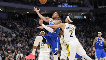 Mar 15, 2025; Milwaukee, Wisconsin, USA;  Milwaukee Bucks forward Giannis Antetokounmpo (34) is fouled on his way to the basket during the third quarter against the Indiana Pacers at Fiserv Forum. Mandatory Credit: Jeff Hanisch-Imagn Images