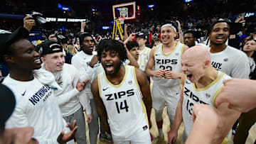 Mar 15, 2025; Cleveland, OH, USA;  The Akron Zips celebrate after winning the MAC Conference Tournament Championship game against the Miami (Oh) Redhawks at Rocket Arena. Mandatory Credit: Ken Blaze-Imagn Images