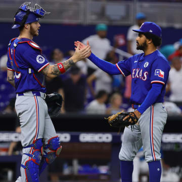 Jun 2, 2024; Miami, Florida, USA; Texas Rangers relief pitcher Grant Anderson (65) celebrates with catcher Jonah Heim (28) after the game against the Miami Marlins at loanDepot Park. 