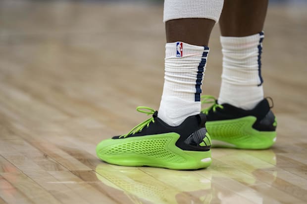 Minnesota Timberwolves guard Anthony Edwards' green and black adidas sneakers.