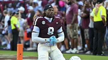 Oct 11, 2025; College Station, Texas, USA; Texas A&M Aggies running back Le'Veon Moss (8) takes a moment prior to the game against the Florida Gators at Kyle Field. Mandatory Credit: Maria Lysaker-Imagn Images 