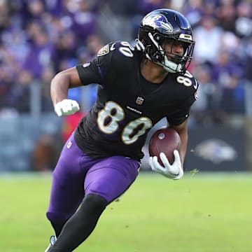 Dec 31, 2023; Baltimore, Maryland, USA; Baltimore Ravens tight end Isaiah Likely (80) runs following his catch for a second quarter touchdown against the Miami Dolphins at M&T Bank Stadium. Mandatory Credit: Mitch Stringer-Imagn Images