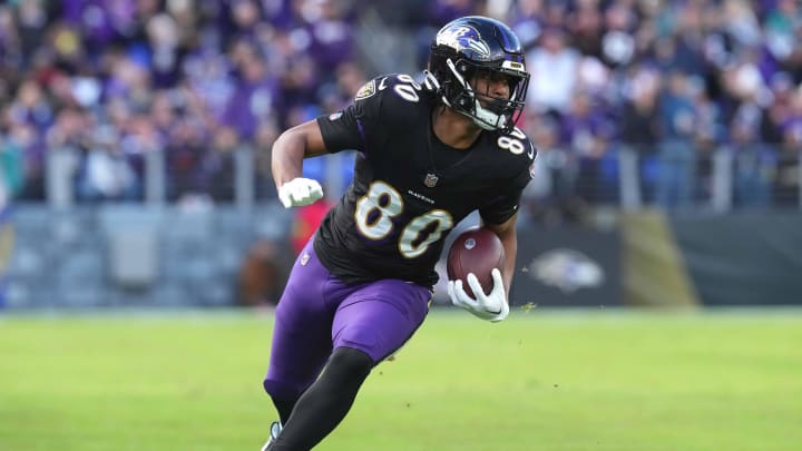 Dec 31, 2023; Baltimore, Maryland, USA; Baltimore Ravens tight end Isaiah Likely (80) runs following his catch for a second quarter touchdown against the Miami Dolphins at M&T Bank Stadium. Mandatory Credit: Mitch Stringer-USA TODAY Sports