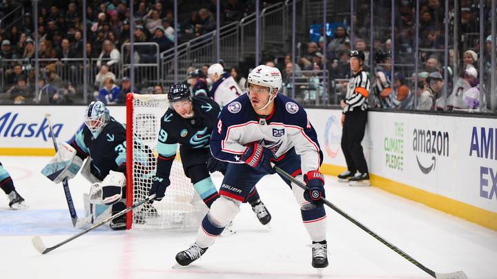 Nov 11, 2025; Seattle, Washington, USA; Columbus Blue Jackets center Cole Sillinger (4) plays the puck during the first period against the Seattle Kraken at Climate Pledge Arena. Mandatory Credit: Steven Bisig-Imagn Images