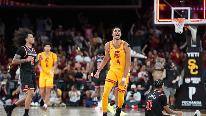 Jan 31, 2026; Los Angeles, California, USA; Southern California Trojans guard Chad Baker-Mazara (4) celebrates at the end of the game as Rutgers Scarlet Knights guard Lino Mark (2) and guard Tariq Francis (0) watch at Galen Center. Mandatory Credit: Kirby Lee-Imagn Images