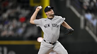 Arlington, Texas, USA; New York Yankees relief pitcher Jake Bird (59) pitches against the Texas Rangers during the tenth inning at Globe Life Field.