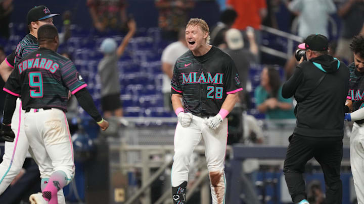 May 3, 2025; Miami, Florida, USA;  Miami Marlins right fielder Kyle Stowers (28) celebrates his walk-off grand slam against the Oakland Athletics in the ninth inning at loanDepot Park. Mandatory Credit: Jim Rassol-Imagn Images