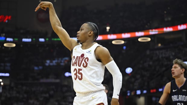 Isaac Okoro shoots a corner three.