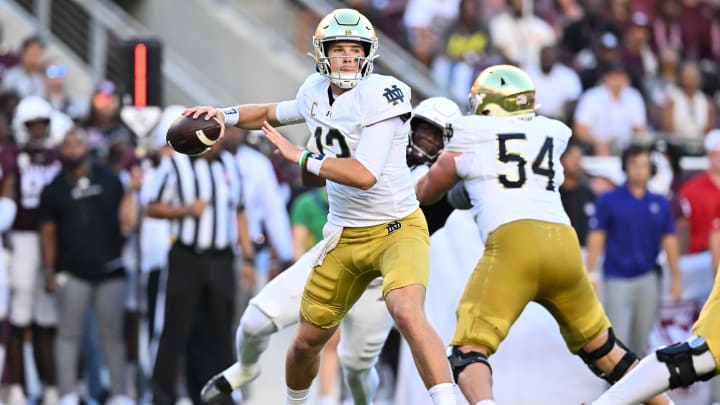 Aug 31, 2024; College Station, Texas, USA; Notre Dame Fighting Irish quarterback Riley Leonard (13) attempts to pass the ball during the first quarter against the Texas A&M Aggies at Kyle Field. 