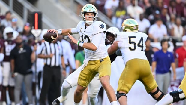 Riley Leonard throws a pass for Notre Dame at Texas A&M