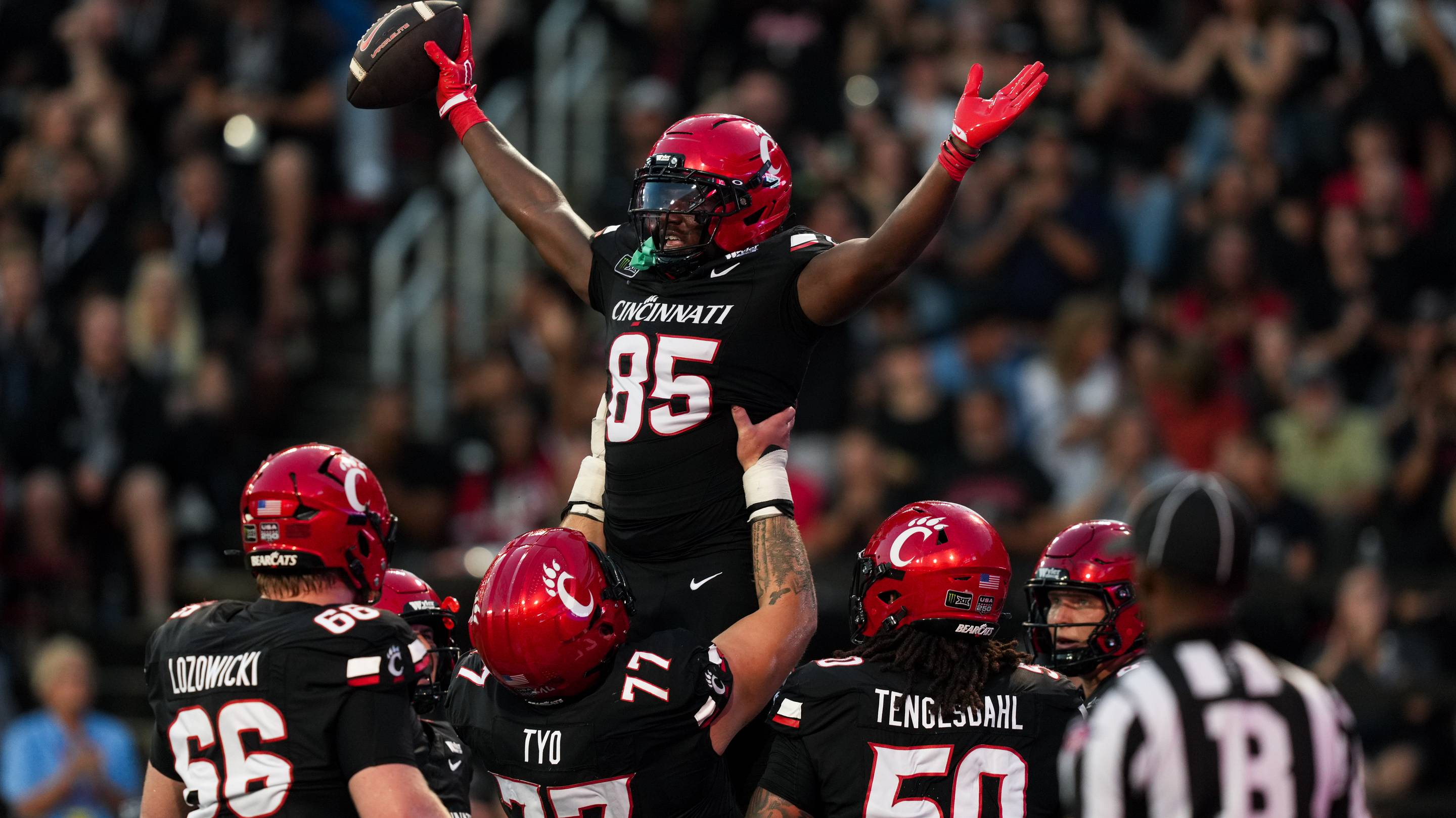 Sep 12, 2026; Cincinnati, Ohio, USA; Cincinnati Bearcats tight end Lyviel Waters (85) celebrates with teammates after scoring a touchdown against the Western Carolina Catamounts in the first half at Nippert Stadium. Mandatory Credit: Aaron Doster-Imagn Images | IMAGN IMAGES via Reuters Connect