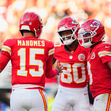 Sep 28, 2025; Kansas City, Missouri, USA;  Kansas City Chiefs wide receiver Tyquan Thornton (80) celebrates with Kansas City Chiefs quarterback Patrick Mahomes (15) and Kansas City Chiefs wide receiver JuJu Smith-Schuster (9) after scoring a touchdown during the third quarter at GEHA Field at Arrowhead Stadium. Mandatory Credit: Jay Biggerstaff-Imagn Images