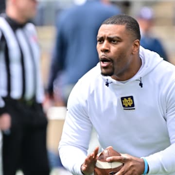 Apr 20, 2024; Notre Dame, IN, USA; Notre Dame Fighting Irish defensive backs coach Mike Mickens participates in warmups before the Blue-Gold Game at Notre Dame Stadium. Mandatory Credit: Matt Cashore-Imagn Images