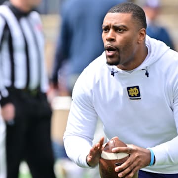 Apr 20, 2024; Notre Dame, IN, USA; Notre Dame Fighting Irish defensive backs coach Mike Mickens participates in warmups before the Blue-Gold Game at Notre Dame Stadium. 