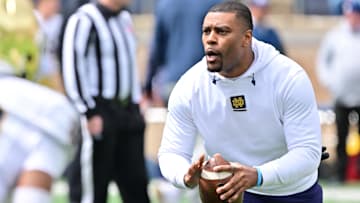 Apr 20, 2024; Notre Dame, IN, USA; Notre Dame Fighting Irish defensive backs coach Mike Mickens participates in warmups before the Blue-Gold Game at Notre Dame Stadium. 