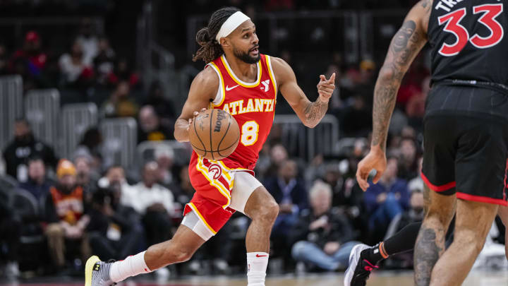 Jan 28, 2024; Atlanta, Georgia, USA; Atlanta Hawks guard Patty Mills (8) brings the ball up the court against the Toronto Raptors during the first half at State Farm Arena. Mandatory Credit: Dale Zanine-USA TODAY Sports