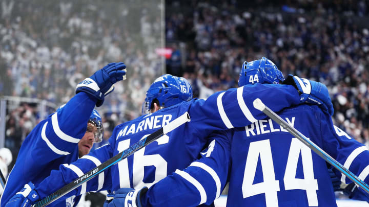 Apr 27, 2024; Toronto, Ontario, CAN; Toronto Maple Leafs right wing Mitch Marner (16) scores a goal and celebrates with center Max Domi (11) and defenseman Morgan Rielly (44) against the Boston Bruins during the third period in game four of the first round of the 2024 Stanley Cup Playoffs at Scotiabank Arena. Mandatory Credit: Nick Turchiaro-USA TODAY 