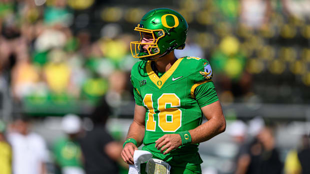 Aug 31, 2024; Eugene, Oregon, USA; Oregon Ducks quarterback Austin Novosad (16) warms up before the game against the Idaho Va