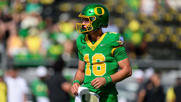 Aug 31, 2024; Eugene, Oregon, USA; Oregon Ducks quarterback Austin Novosad (16) warms up before the game against the Idaho Va