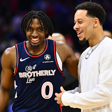 Mar 16, 2024; Philadelphia, Pennsylvania, USA; Philadelphia 76ers guard Tyrese Maxey (0) reacts with Charlotte Hornets guard Seth Curry (30) after the game at Wells Fargo Center. Mandatory Credit: Kyle Ross-Imagn Images