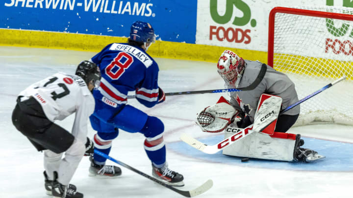 Aug 3, 2024; Plymouth, MI, USA; Canada's goaltender Joshua Ravensbergen (31) makes a save on USA’s forward AJ Spellacy (8) during the second period of the 2024 World Junior Summer Showcase at USA Hockey Arena. Mandatory Credit: David Reginek-USA TODAY Sports